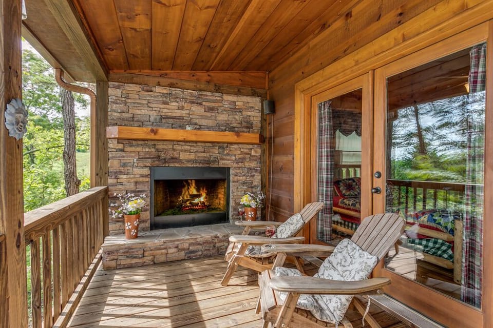 Outdoor fireplace located on the deck right outside of Master Bedroom