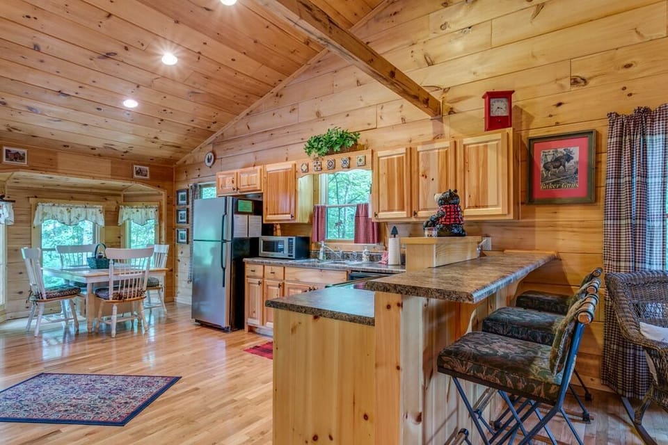 Kitchen area with bar stool seating