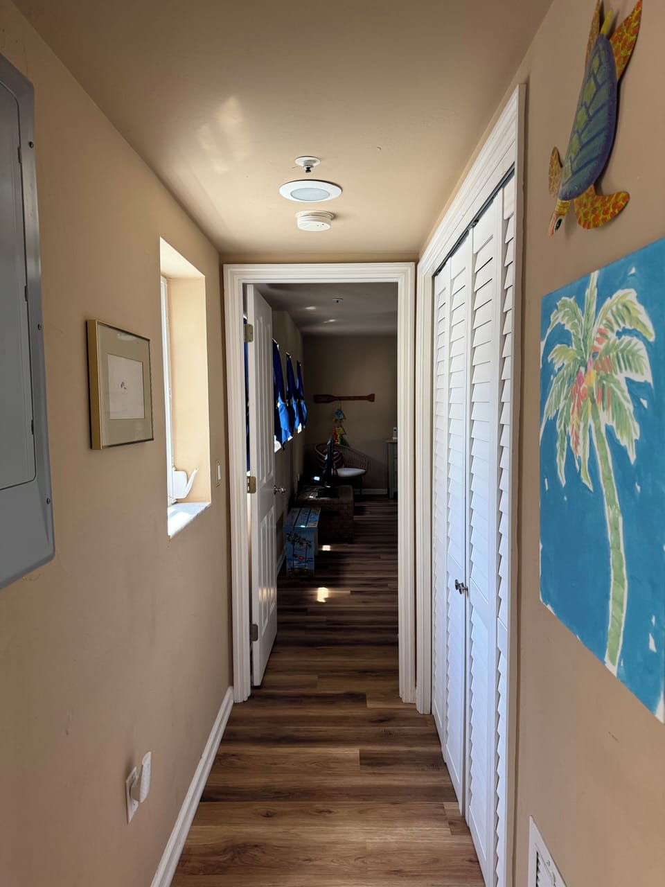 Hallway to second BR, main floor.  Full size washer and dryer to the right.