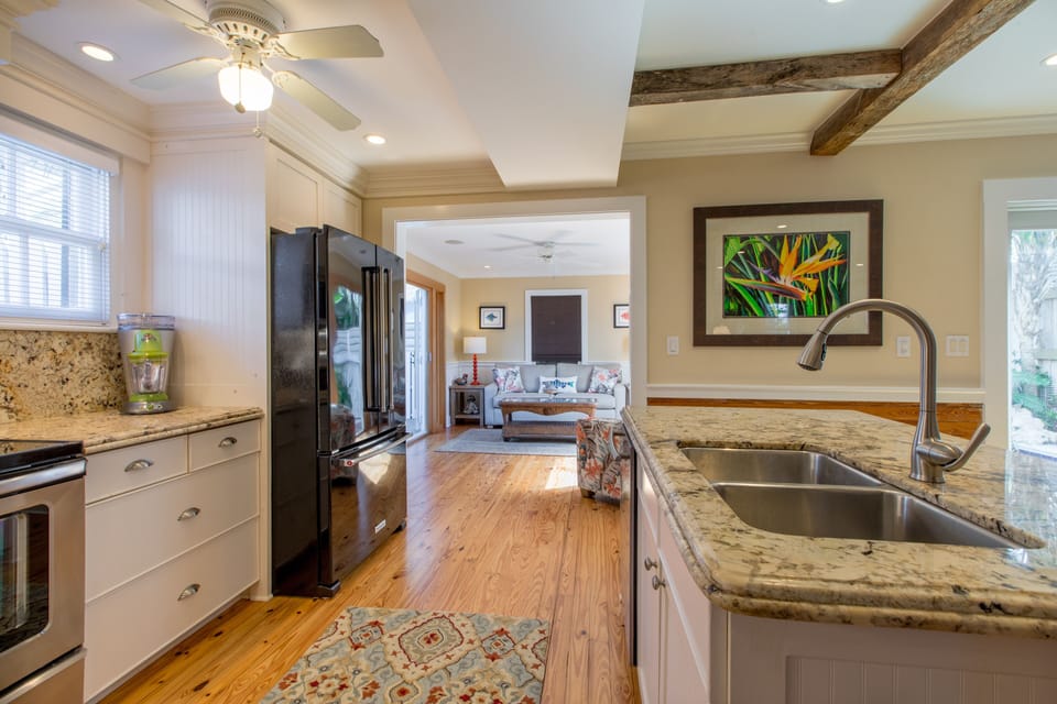 Open kitchen and dining room area with dining seating for 4