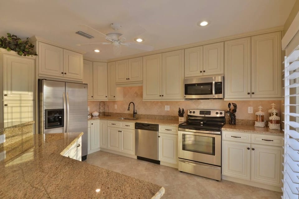 Gourmet kitchen with granite and stainless steel appliances