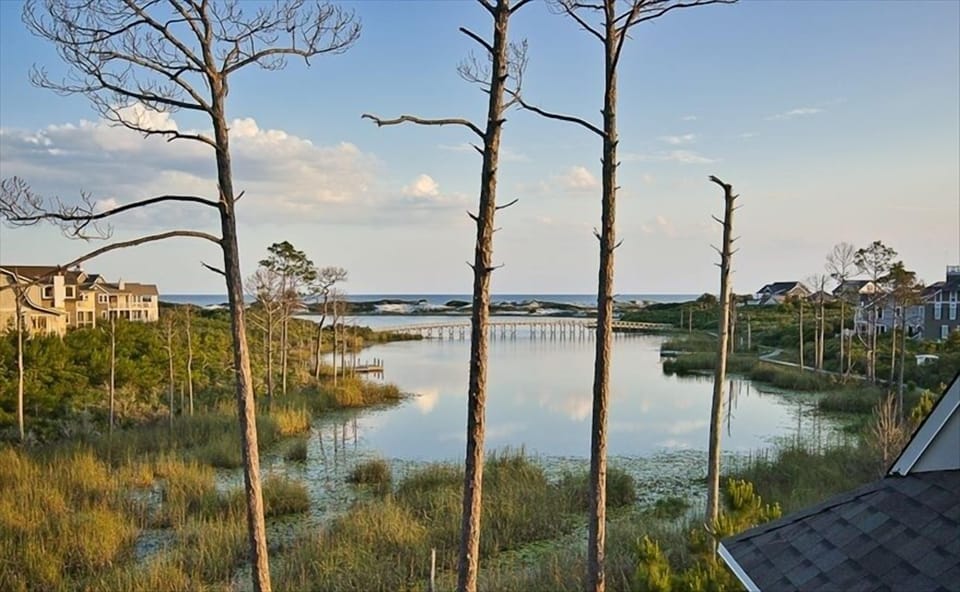 Lake and Gulf view from living room, dining , kitchen and 2 porches.