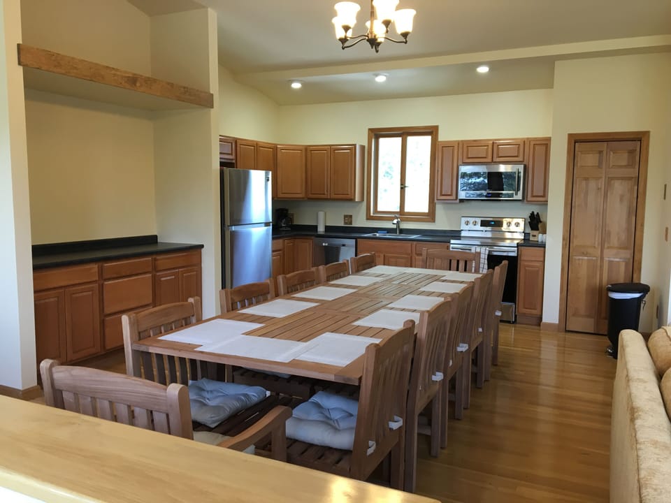 Teak dining table seats 12 (as shown) with leaf; or store leaf and it seats 8.