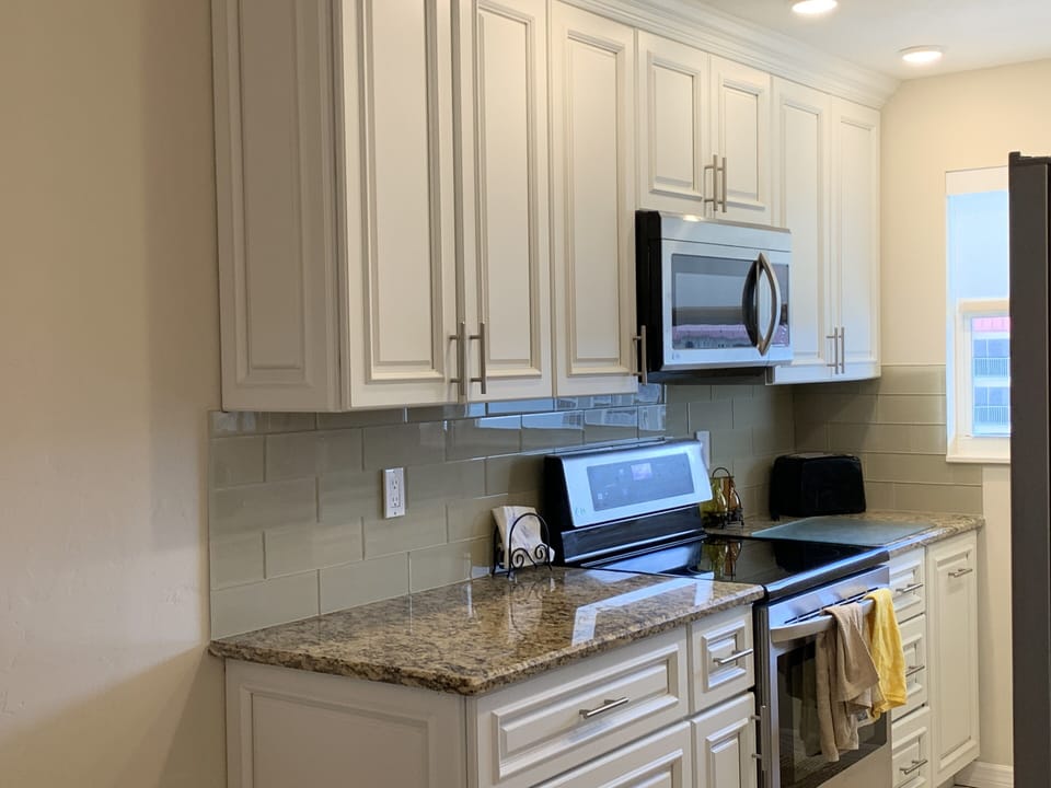 Kitchen granite counters back splash LG appliances