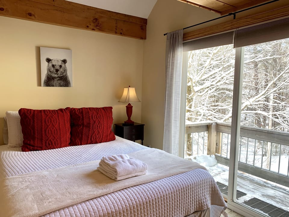 Guest room with private balcony and smart tv. 