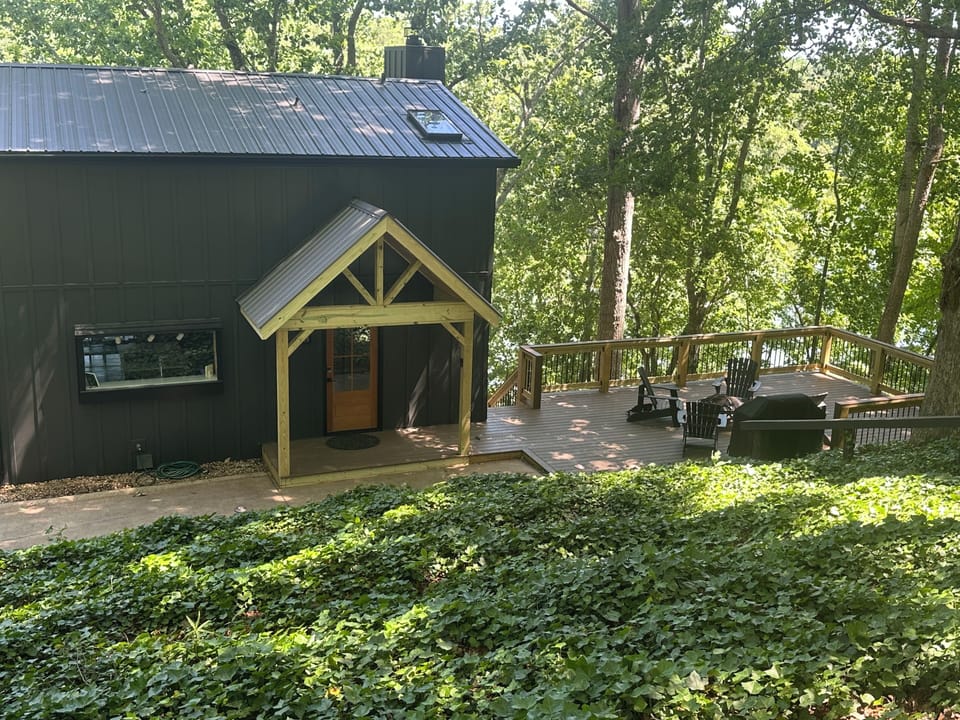 Front of the house with a new deck overlooking the lake!