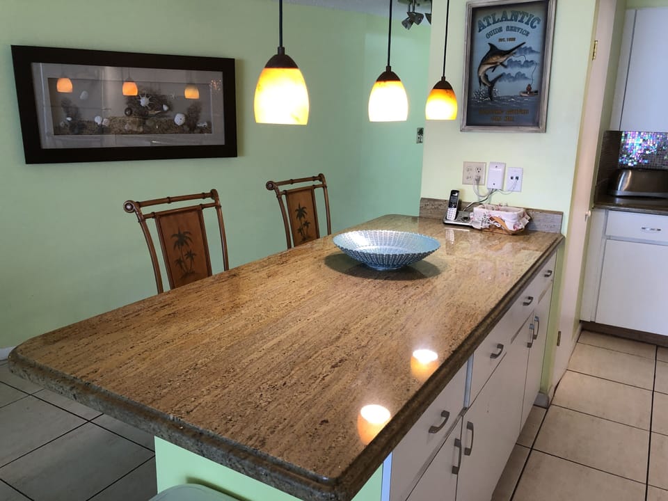Granite top kitchen breakfast bar, beautiful iridescent glass mosaic backsplash!