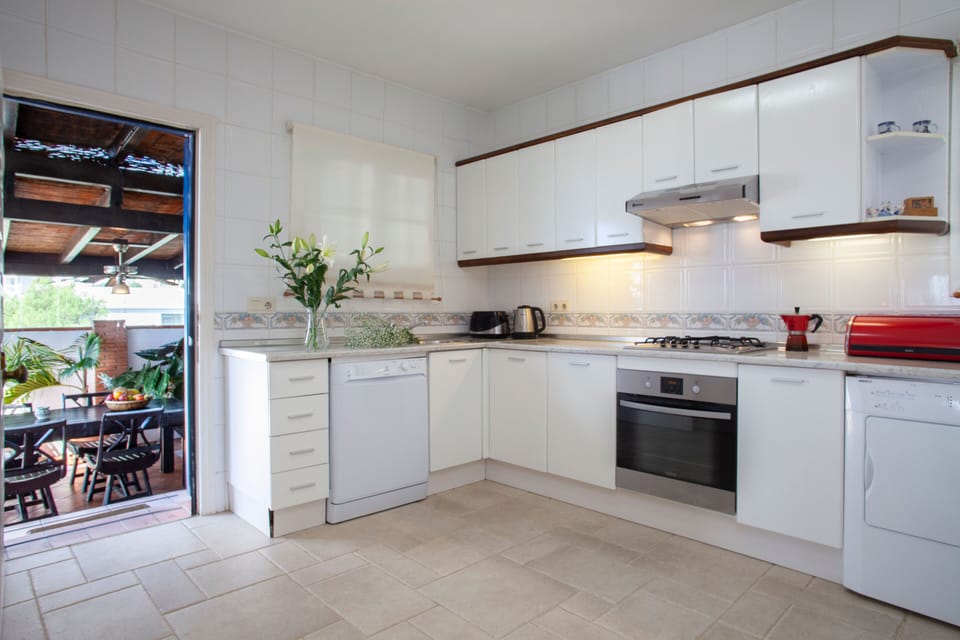 Old kitchen leading to the outside covered pergola