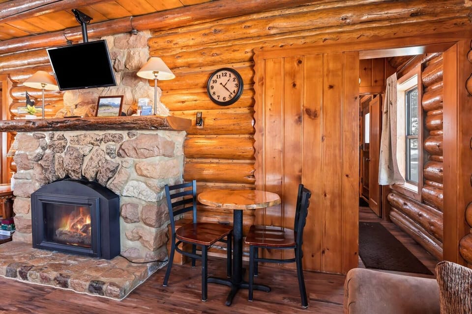 Nestled beside the fireplace, the comfortable seating area invites you to unwind and enjoy the warmth, creating an intimate space for relaxation and conversation.