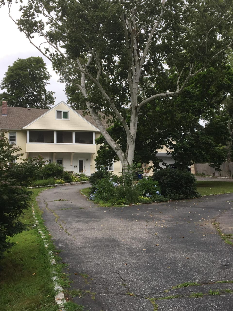 It’s a long circular driveway as we sit to the back of a one acre lot