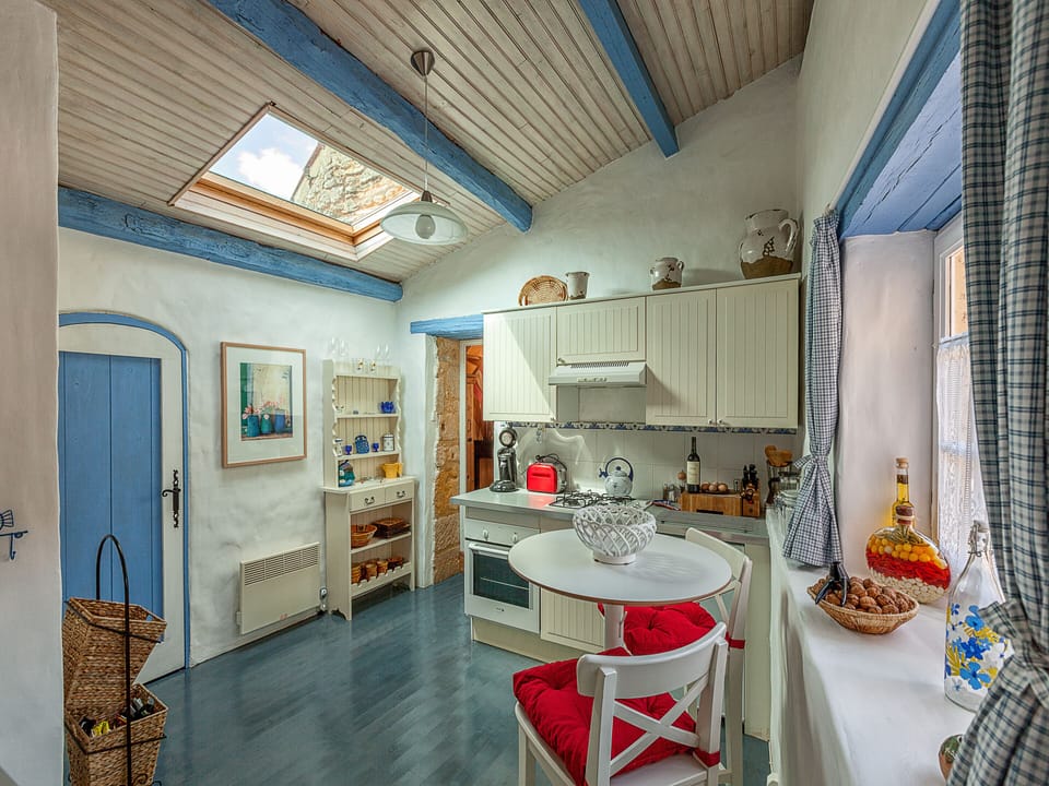 Bright and airy kitchen with a beautiful sky light and wonderful painted floors