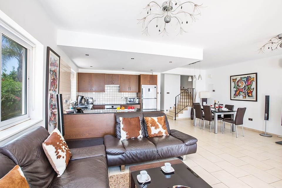 Living room with comfortable sofas, coffee table and widescreen TV