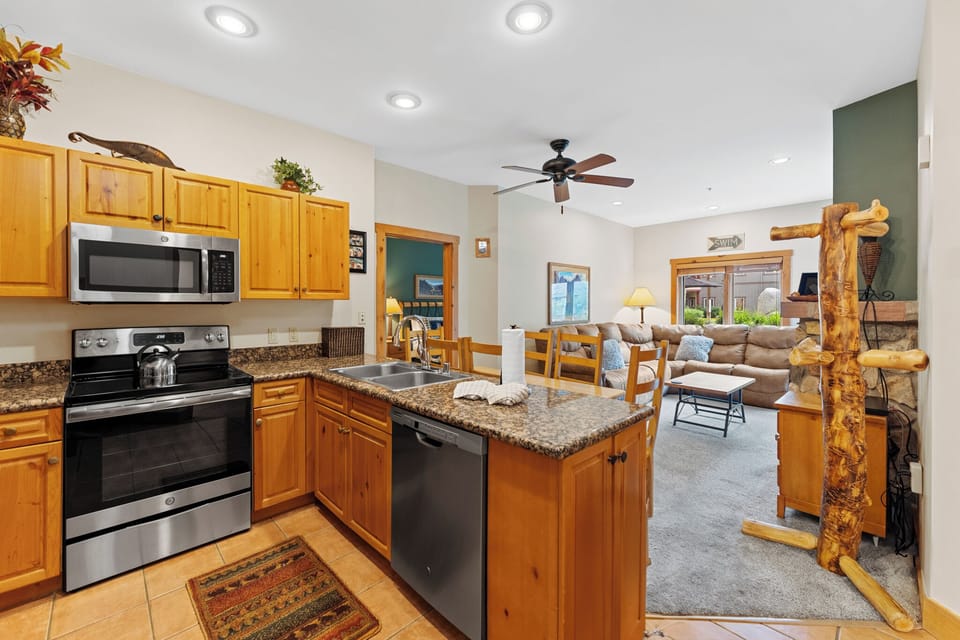 Full kitchen featuring stainless steel appliances.
