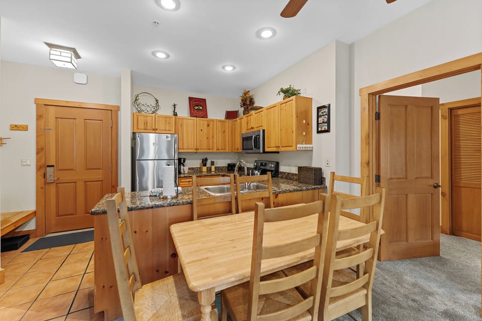 Full kitchen featuring stainless steel appliances.