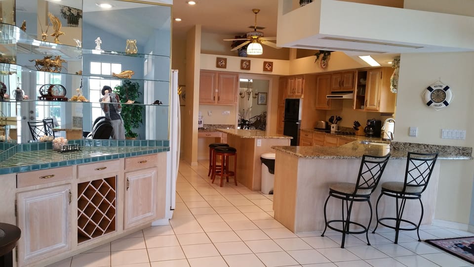 Spacious kitchen with island and bar area.