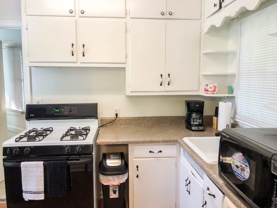 kitchen with ice-water-refrigerator, stove-oven, microwave-toaster, coffee, tea