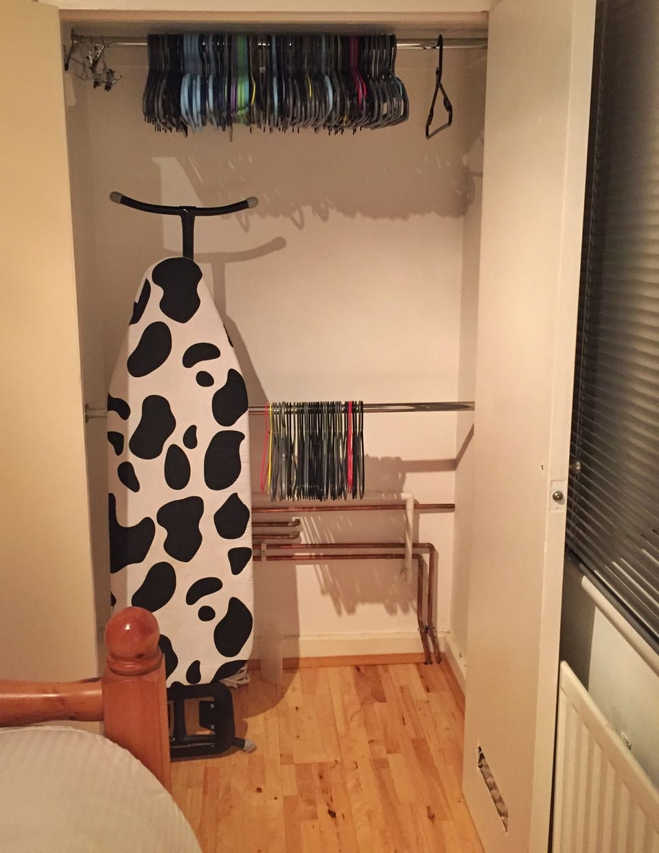 Dedicated cupboard for guests with iron and ironing board