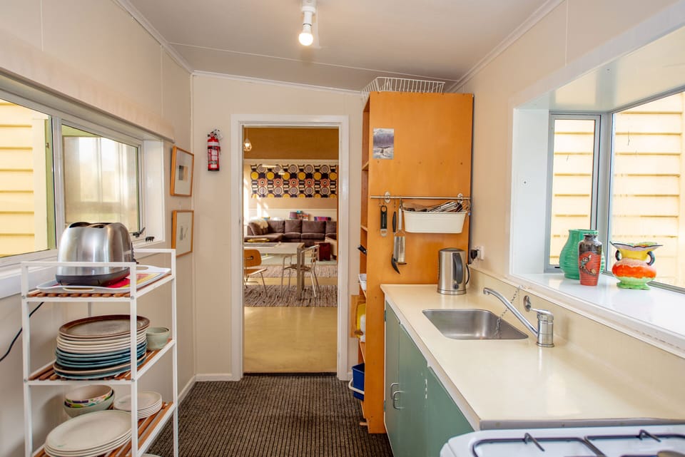 Kitchen view into dining and lounge