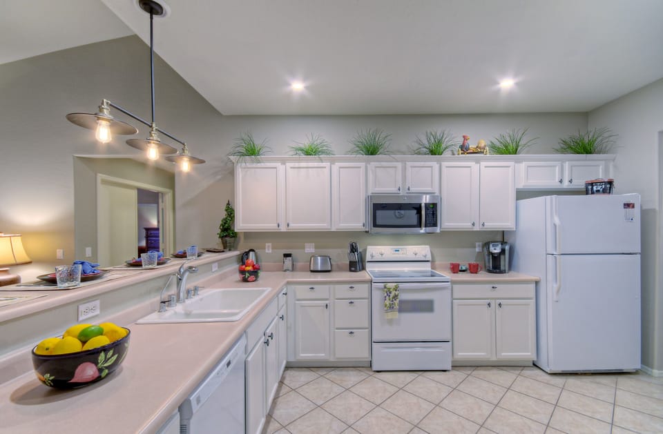 Kitchen cabinets are filled with all the gadgets and conveniences the chef needs.