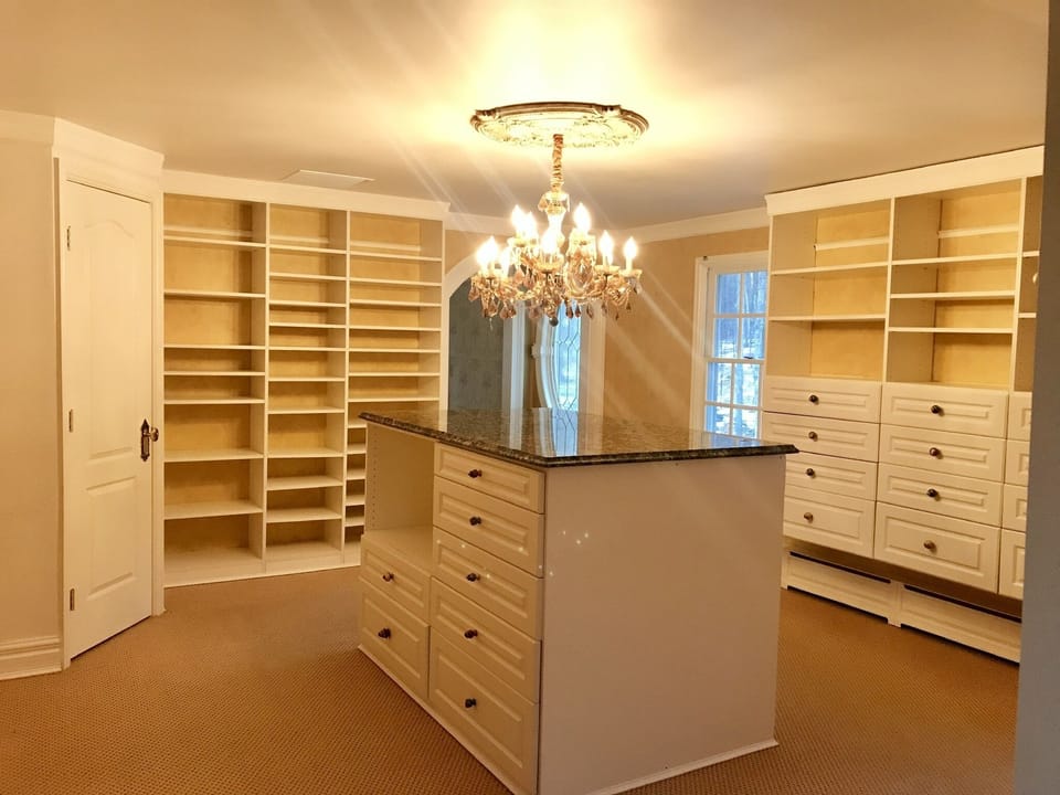 Plenty of room for storage in large master bedroom closet 