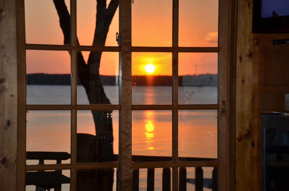 View out of cabin bar window at sunset.