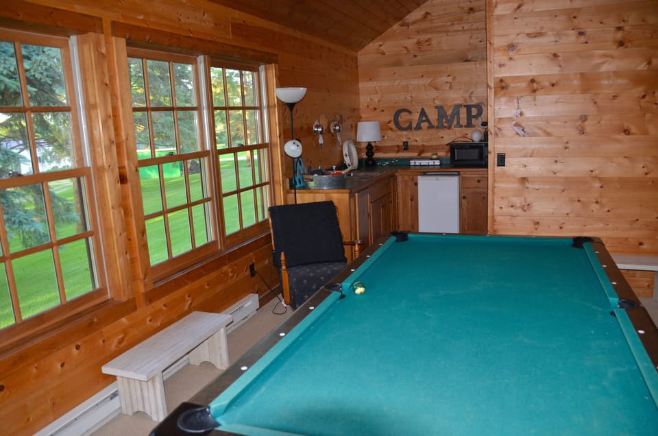 Pool table and mini kitchen in guest cabin.