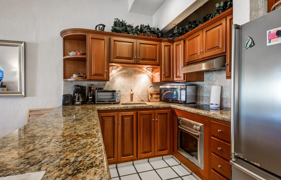 High end kitchen with a Bosh stovetop and Fagon Oven.