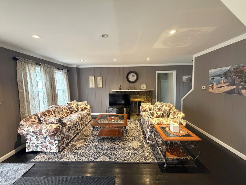 Living area - 2 Sofas, a smart TV and a coffee table.
