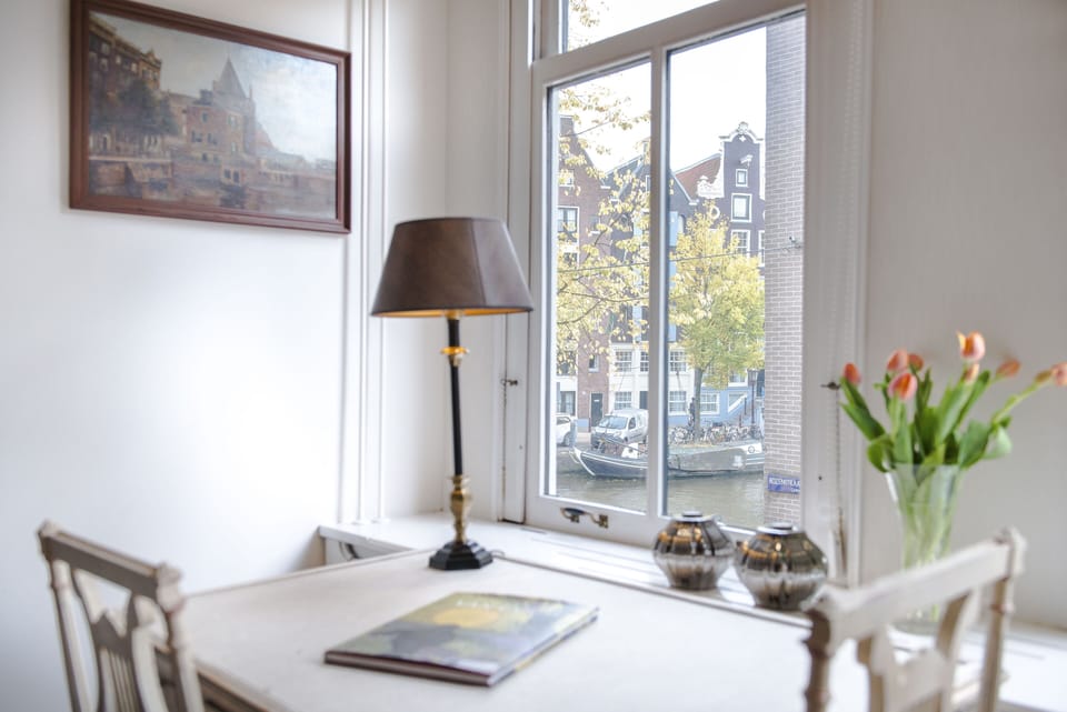 Gaze out while sitting at the antique overlooking the canal 