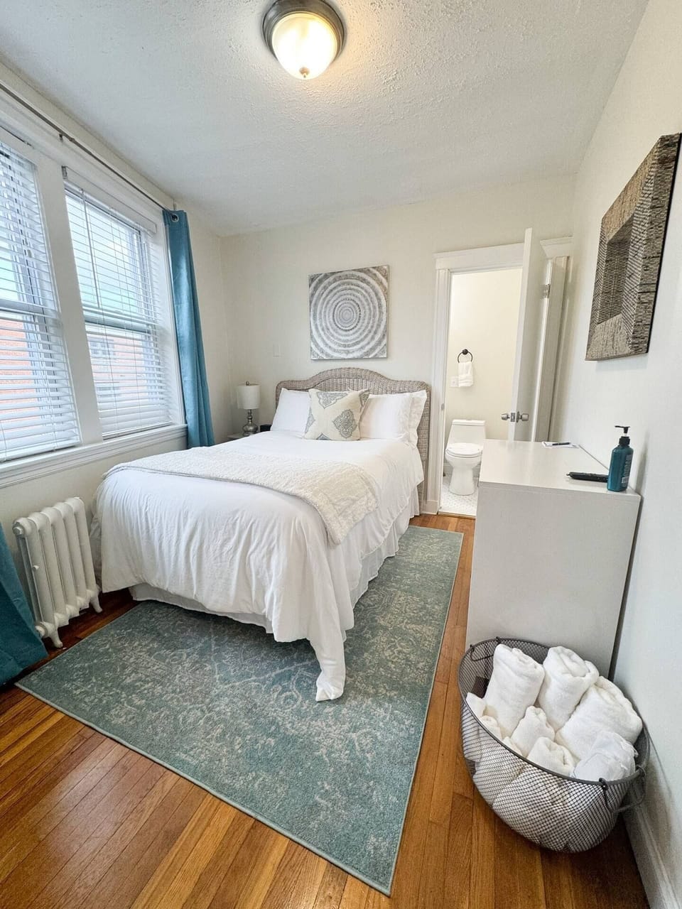 Bathroom through the bedroom, fresh linens and towels always stocked in the basket