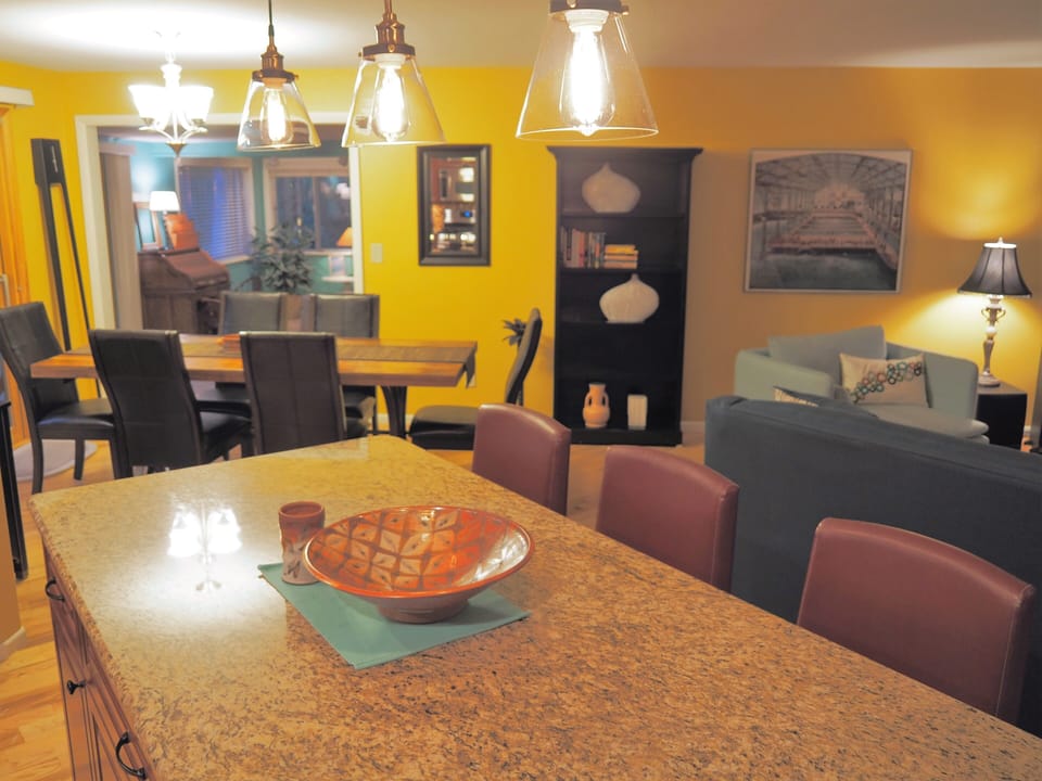View from kitchen to dining area and sunroom beyond 