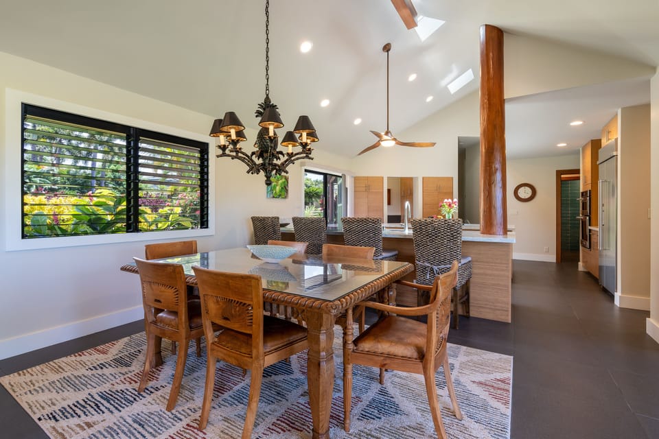 Indoor dining for 6 under the pineapple chandelier, Bar stool seating for 4