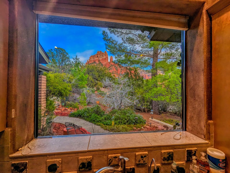 Standing at the sink in the kitchen - looking east at Snoopy rock 