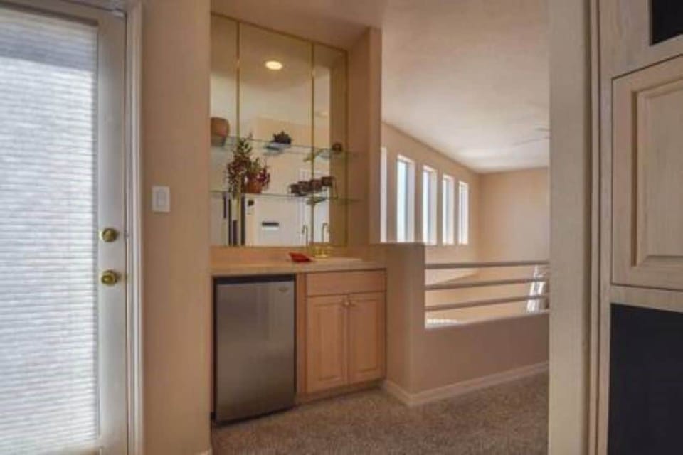 Wet bar with mini frig. door leads to a balcony with amazing views!!