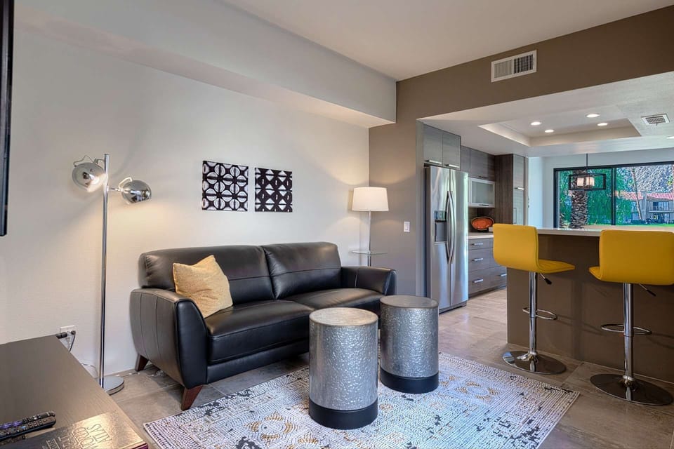 Entertainment Room with couch and bar stools