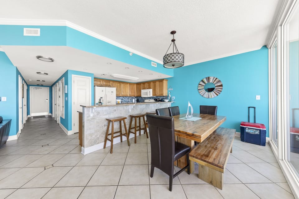 Dining table for 6 and a kitchen bar with 4 stools.