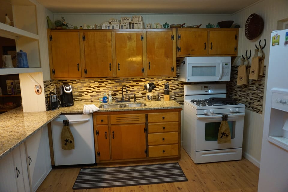 Kitchen with new granite countertops and tile backsplash
