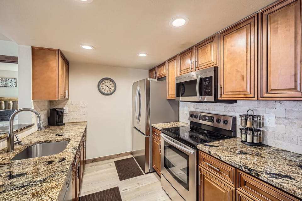 Galley kitchen with new appliances.