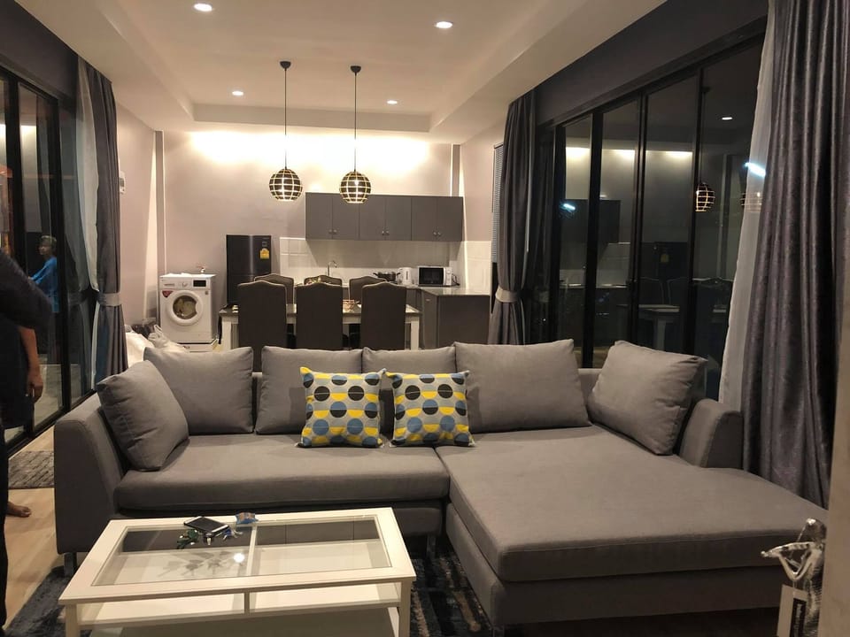 Living room with kitchen ,nice dinning area and big sofa