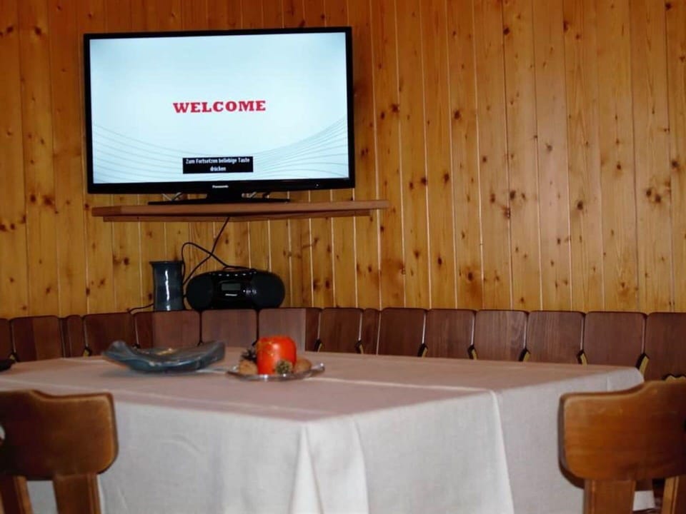 Furniture, Table, Property, Tableware, Chair, Wood, Interior Design, Orange, Tablecloth, Flooring
