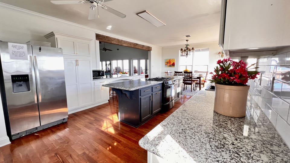 Well stocked kitchen with open floor plan.  Plenty of space to cook and visit.