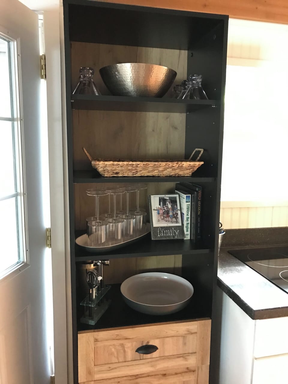 Added this cabinet for extra glasses and trays/bowls for entertaining.