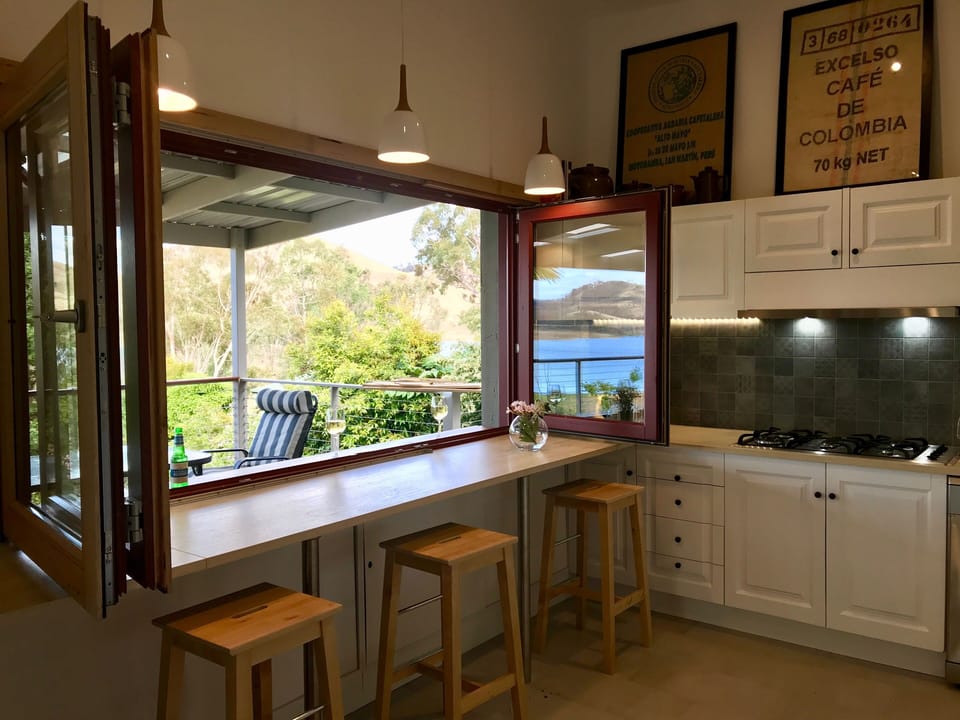 Servery window opening to verandah from kitchen.