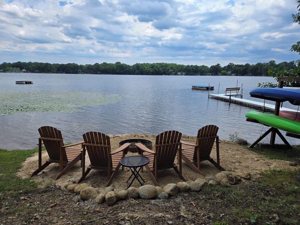 The fire pit and view of the lake, the pier and floating platform to the right is our neighbor's. our pier is to the left of the firepit. 