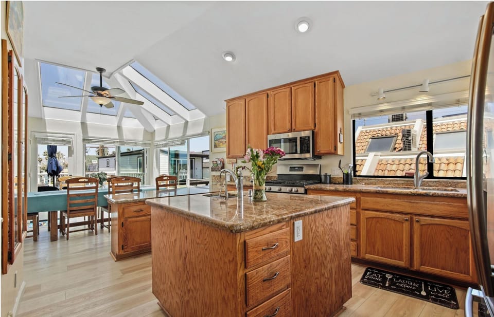 Spacious cook's kitchen flows into dining area.