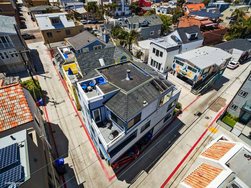 Aerial photo shows the roof deck which provides a panoramic view of the area