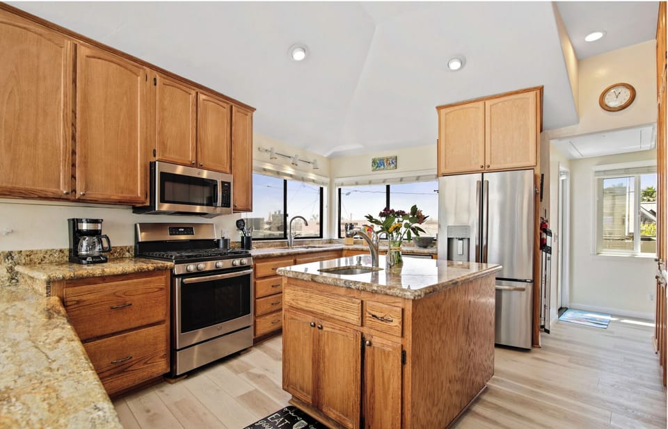 Expansive kitchen is well stocked with most everything needed for meal prep.
