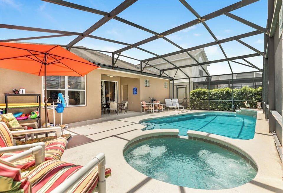 Pool/Spa with outdoor dining and BBQ.