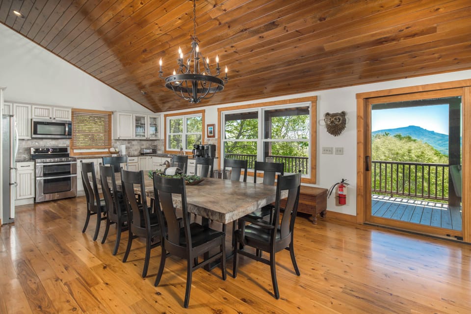 Large dining area with mountain views and easy access to the fully equipped kitchen