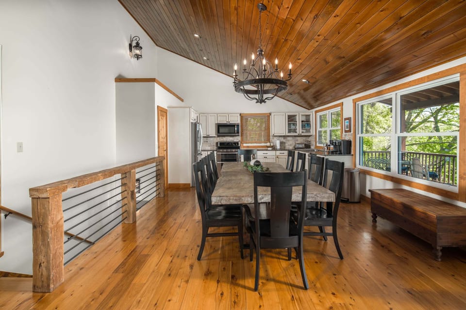 Bright and inviting dining space with rustic wood finishes and plenty of seating